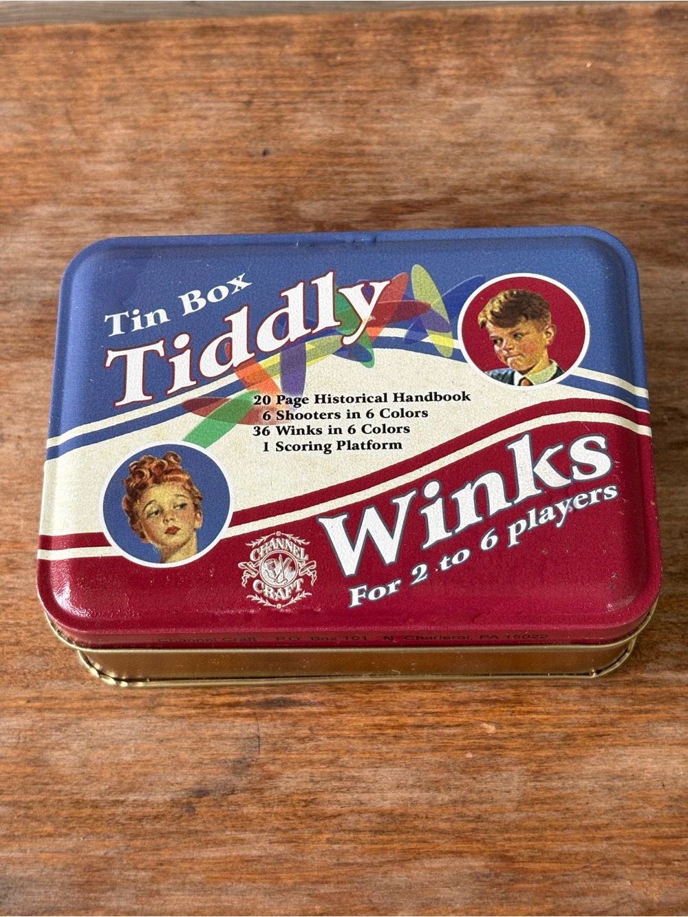 Channel Craft Tiddly Winks game features a classic red and blue tin container.